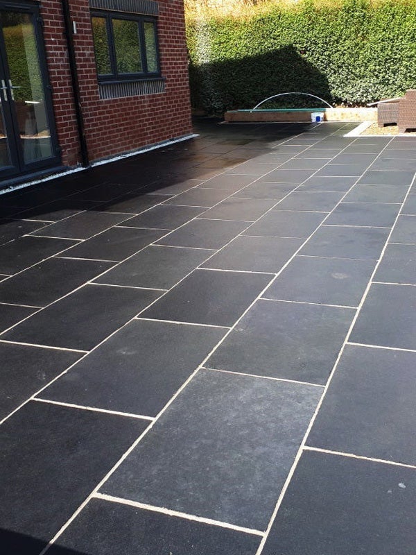 Black Limestone Patio Slabs – slip-resistant and weathered look for gardens.