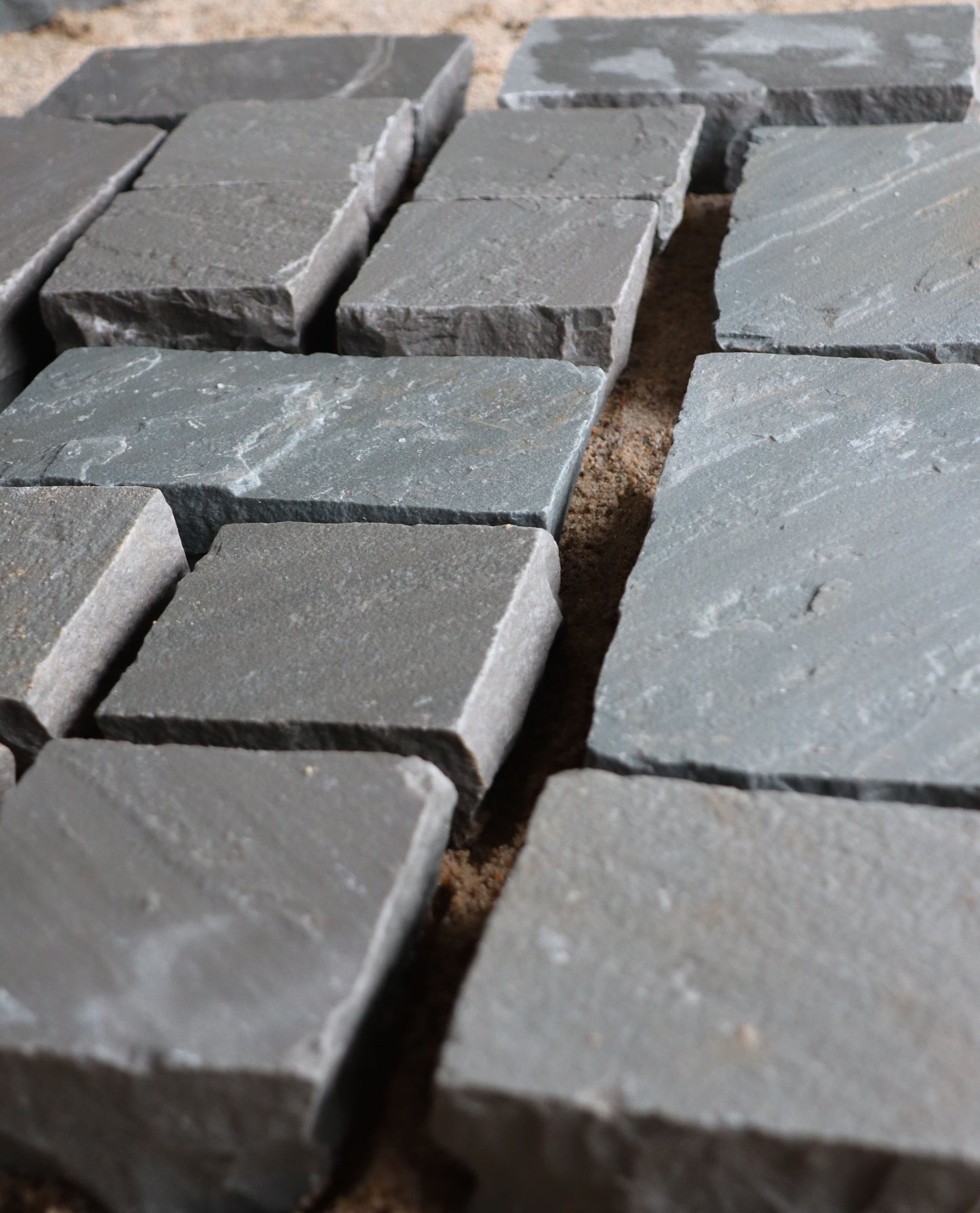 Sandstone Cobble Setts in Kandla Grey – riven surface cobblestones ideal for patios and courtyards